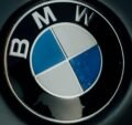 Detailed image of the iconic BMW logo displayed on a car hood.
