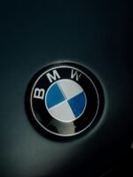 Detailed image of the iconic BMW logo displayed on a car hood.